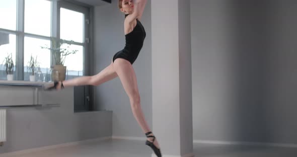 Pretty Ballet Dancer Does Big Jump in Dance Studio in Slow Motion, Ballet Rehearsal, Ballerina Does alt