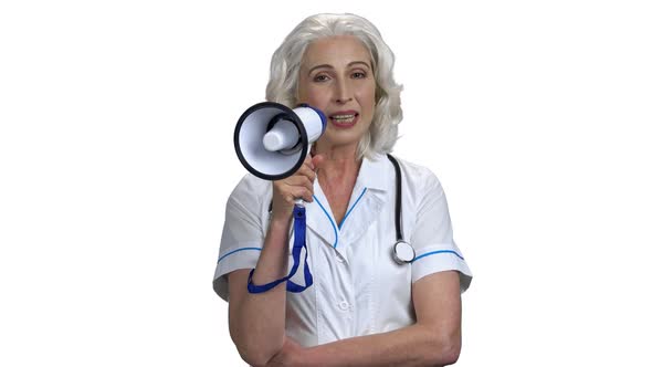 Portrait of Senior Friendly Doctor Talking Into Megaphone alt
