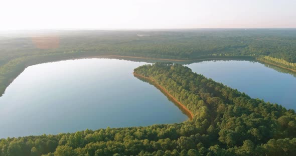 Panoramic View of Landscape with Morning Fog Over the Lake Near the Forest alt