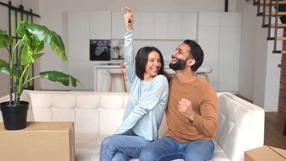 Excited Proud Overjoyed Indian Couple Showing Keys From New Home