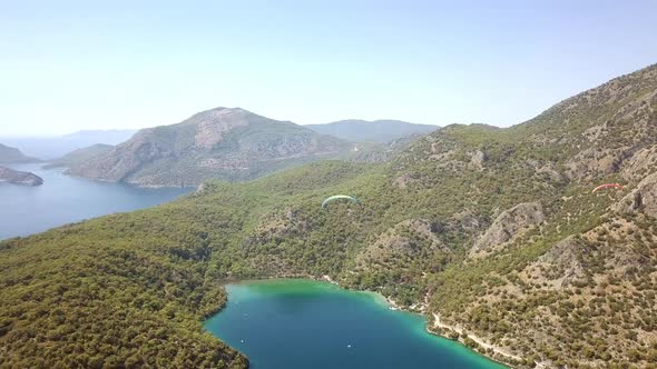 Paragliders Flying Over Sea and Beach on Resort