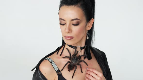 Big Black Spider on a Woman's Chest alt