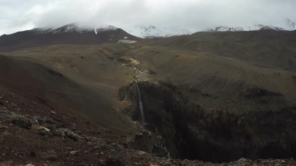 Kamchatka Peninsula: Waterfall in Dangerous Canyon at Foot of Mutnovsky Volcano