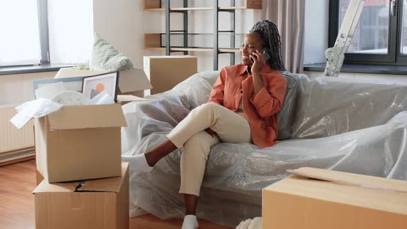 Happy Woman Calling on Phone Moving to New Home