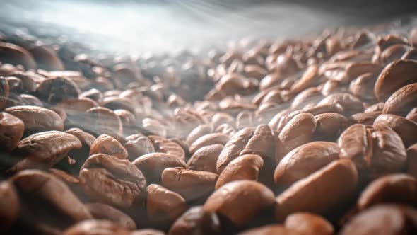Close Up of Seeds of Coffee. Fragrant Coffee Beans Are Roasted Smoke Comes From Coffee Beans. alt