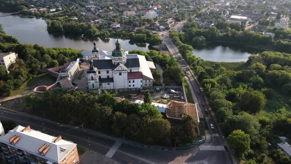 Beautiful Catholic Church with the Picturesque River on the Background