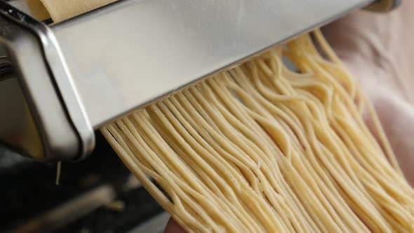 Manually processed Italian spaghetti food 4K 2160p 30fps UltraHD footage - Dough made  cylindrical s alt