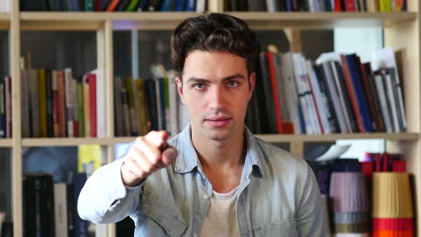 Young Man Pointing at Camera, Gesture alt