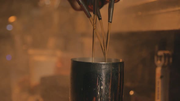 Cocktail preparation slow motion, smoky warm atmosphere