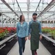 Agricultural Engineer Walks Through Industrial Greenhouse with Professional Farmer. They Examine - VideoHive Item for Sale