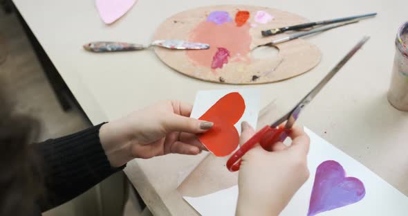 Cutting a Card for St Valentine's Day From Paper