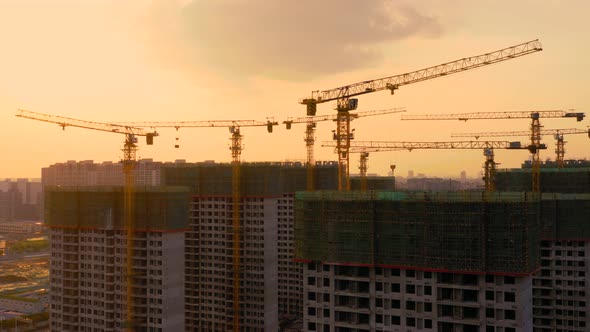 Aerial of construction site at sunset alt