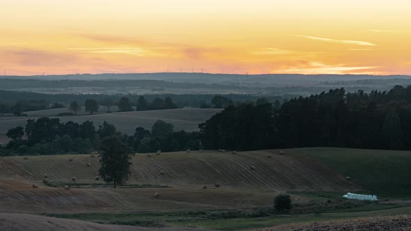 Fields on a Hills During Sunset with Golden Sunlight Time Lapse