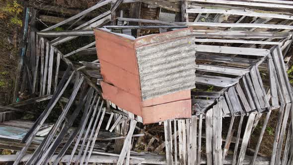 Abandoned Rural House with Collapsed Roof Aerial View alt