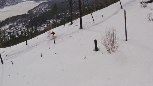 Drone Shot of Man Freeriding in the Mountains on Skis