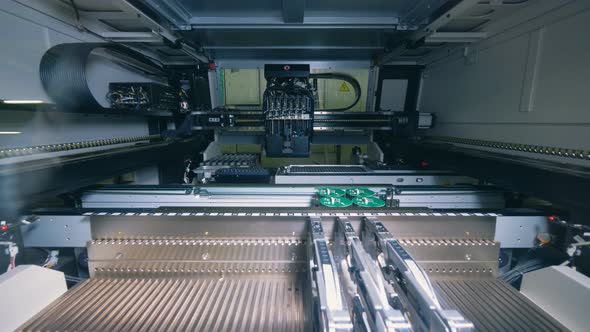 A Machine Makes System Boards, Close Up. alt