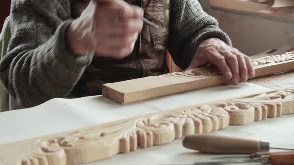 Closeup shoot of a woodcarver at work