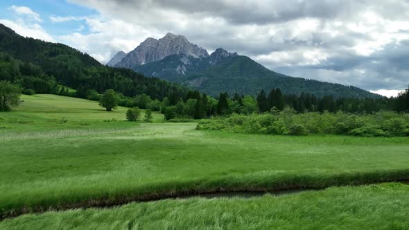 Beautiful lake and mountains in a hilly countryside alt