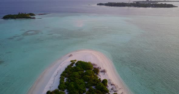 Beautiful overhead tourism shot of a sunshine white sandy paradise beach and blue water background  alt