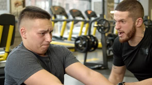 Young Man Shouted at By Instructor While Working Out in Gym