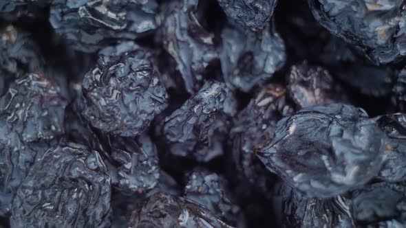 Close Up Heap of Dried Raisins on Rotating Surface  Top View Macro