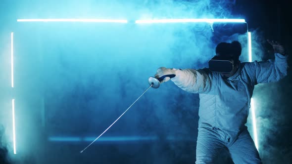 A Man is Practicing Fencing in Virtual Reality alt