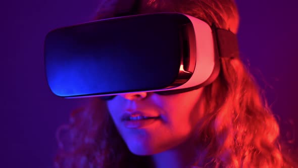Young ginger hair girl using virtual reality headset alt