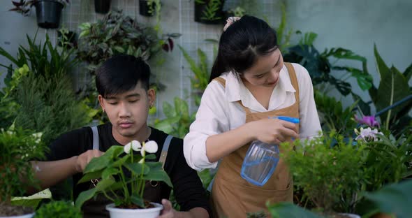 Couple gardening together in the garden alt