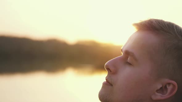 Close Up of Pensive Handsome Face Young Man Enjoying Nature Opening Eyes Summer Adventure