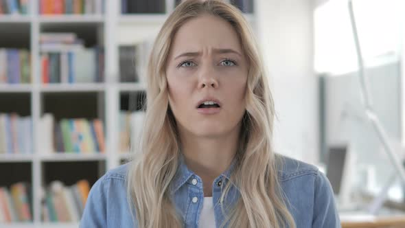 Young Woman Upset by Loss alt