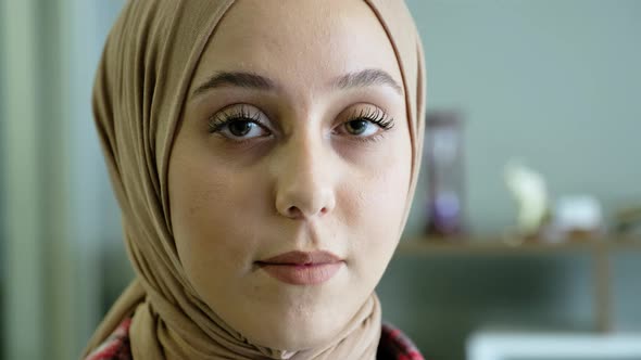 Beautiful middle eastern woman looking at camera alt