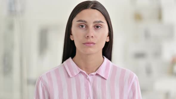 Portrait of Young Latin Woman Looking at Camera alt