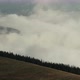 Time Lapse Fog Floating in Mountain Valley with Pine Forest Foreground - VideoHive Item for Sale