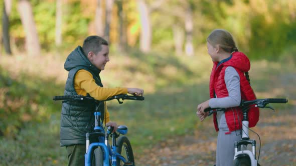 Children with Bicycles in Nature
