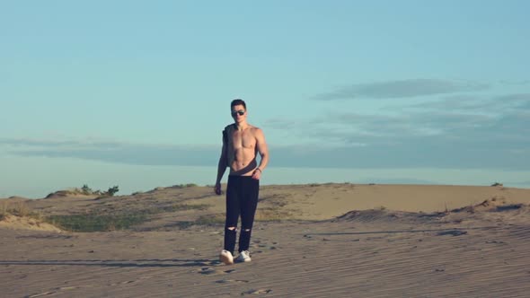 Sexy Man Going in Desert