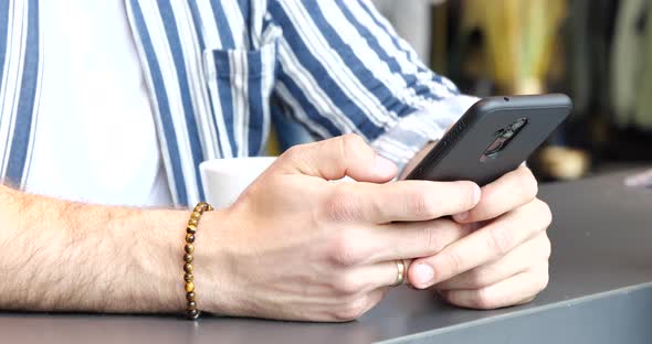 Technology Concept Close Up of Hands Typing on Smartphone 