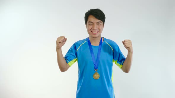 Asian Man Happy With Gold Medal alt