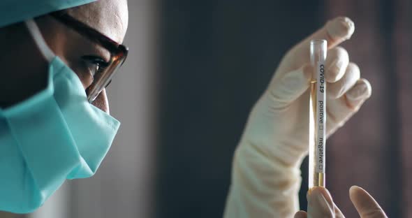 Doctor holding a coronavirus COVID-19 test tube