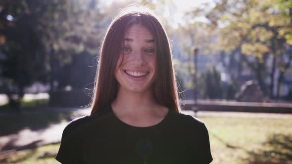 Attractive Young Woman Saying Yes By Shaking Head Outdoors alt