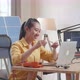 Asian Woman Assemble The Wind Turbine While Working With Laptop Next To The Solar Cell At The Office - VideoHive Item for Sale