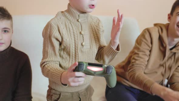 Children Play on the Console with Joysticks in Ruhs