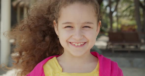 Cute Child Portrait Little Girl Smiling Child Looking at Camera Are Walking on Street alt