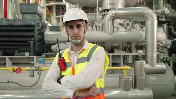 Caucasian engineer manager man looking at camera with confident smile and Crossed arms