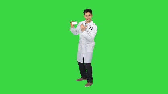 Young Doctor Presenting New Pills and Dancing on a Green Screen, Chroma Key alt