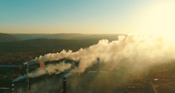 Metallurgical Production Smoke Emits From the Factory Smokestacks  alt