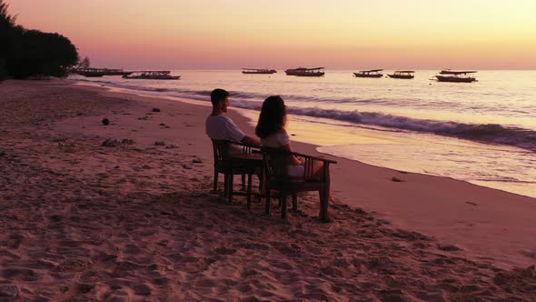 Young Boy and Girl Married on Vacation Enjoy Life on Beach on Clean White Sand alt