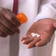 Close up of doctor&#39;s hands displaying  medication - VideoHive Item for Sale