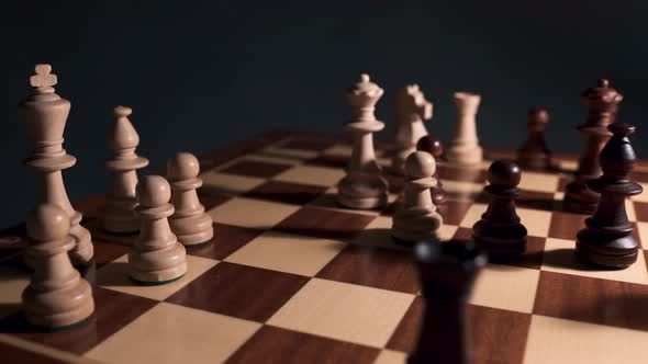 Chess closeup in dramatic light.  alt