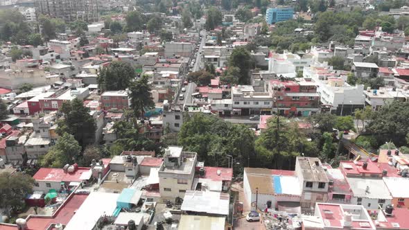 Aerial view of the houses at Barrio La Concepció at southern Mexico City. Drone flying sideways. alt