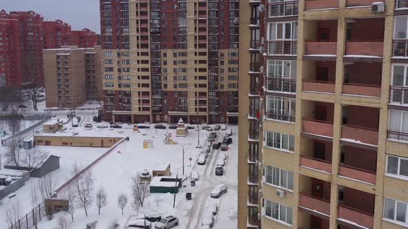 Modern Brick House and Snowcovered Yard After Snowfall